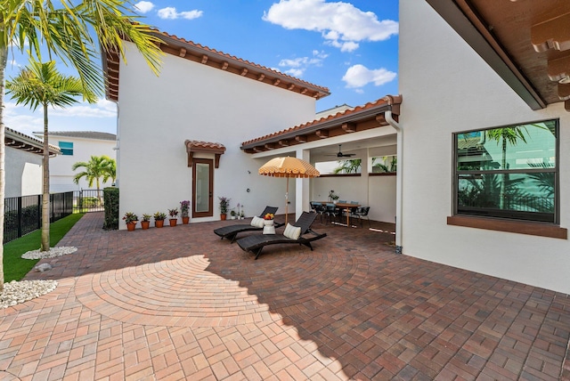 view of patio featuring ceiling fan