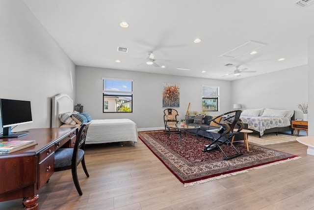 bedroom featuring light hardwood / wood-style floors and ceiling fan