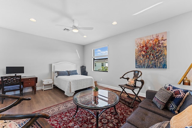 bedroom featuring ceiling fan and dark wood-type flooring