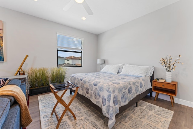 bedroom featuring hardwood / wood-style floors and ceiling fan