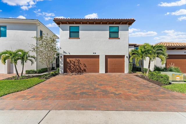 mediterranean / spanish-style house featuring a garage