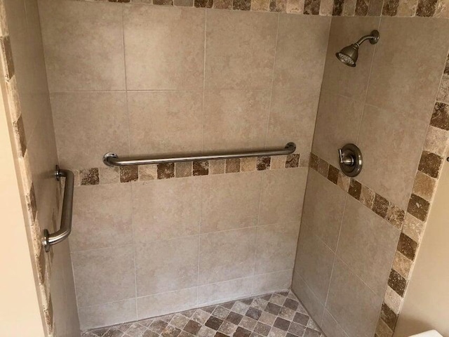 bathroom with tiled shower