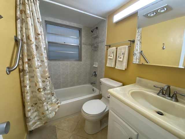 full bathroom with tile patterned flooring, vanity, toilet, and shower / bath combo with shower curtain