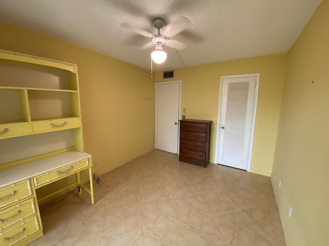 95 Cambridge E Unit 95, West Palm Beach, FL 33417 - unfurnished office featuring ceiling fan and baseboards