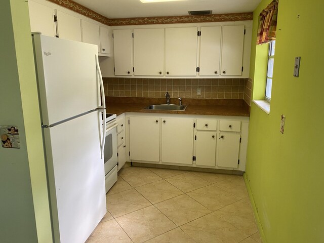 95 Cambridge E Unit 95, West Palm Beach, FL 33417 - kitchen with white appliances, a sink, tasteful backsplash, and light tile patterned flooring