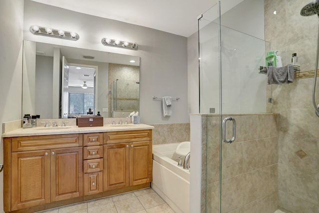 bathroom featuring tile patterned flooring, vanity, and independent shower and bath