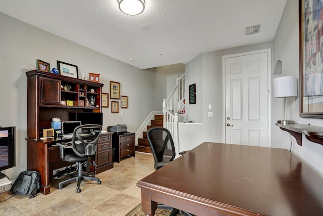 office area featuring a textured ceiling