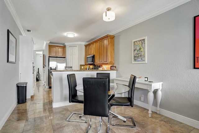 dining area featuring ornamental molding