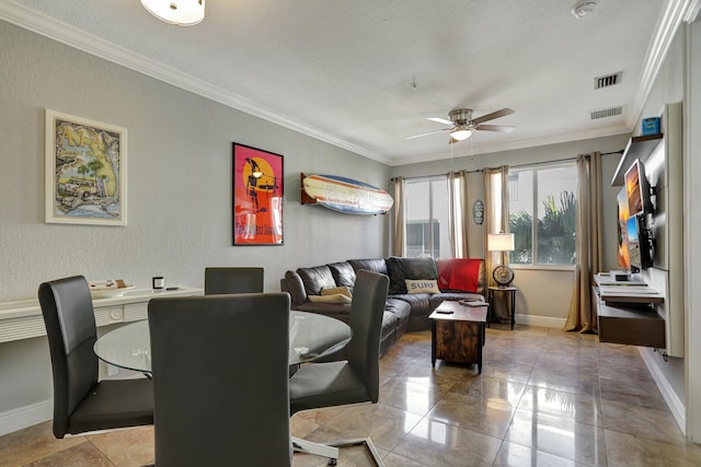 living room with ceiling fan, a textured ceiling, and ornamental molding