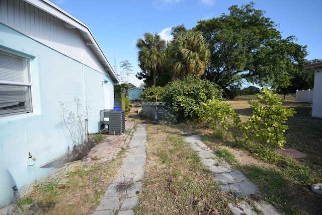 view of yard with central air condition unit