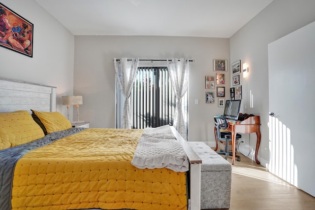 bedroom with hardwood / wood-style floors