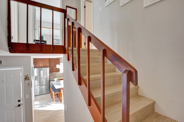 stairs featuring wood-type flooring