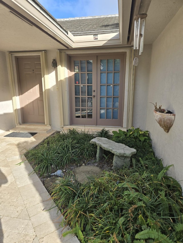 view of exterior entry featuring french doors