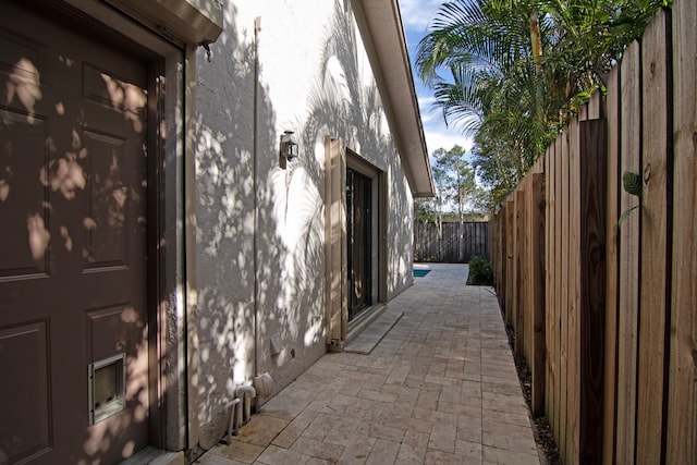 view of property exterior featuring a patio area