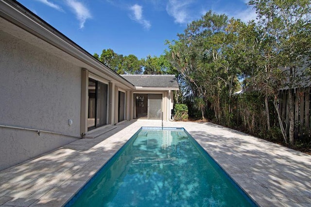 view of swimming pool with a patio area