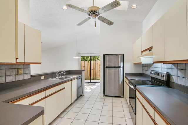 kitchen featuring tasteful backsplash, stainless steel appliances, ceiling fan, sink, and light tile patterned floors