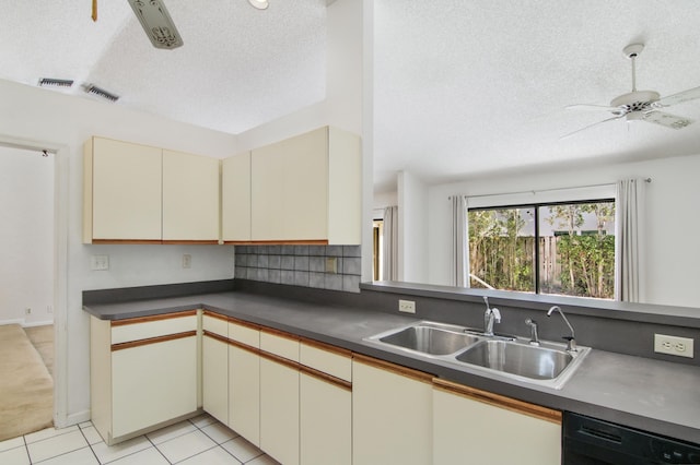 kitchen featuring ceiling fan, sink, black dishwasher, cream cabinets, and light tile patterned flooring