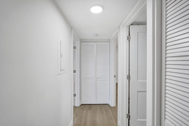 corridor with light wood-type flooring