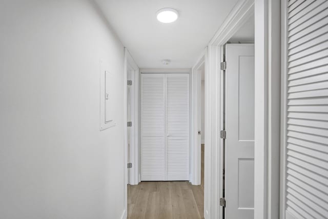 corridor with light wood-style flooring