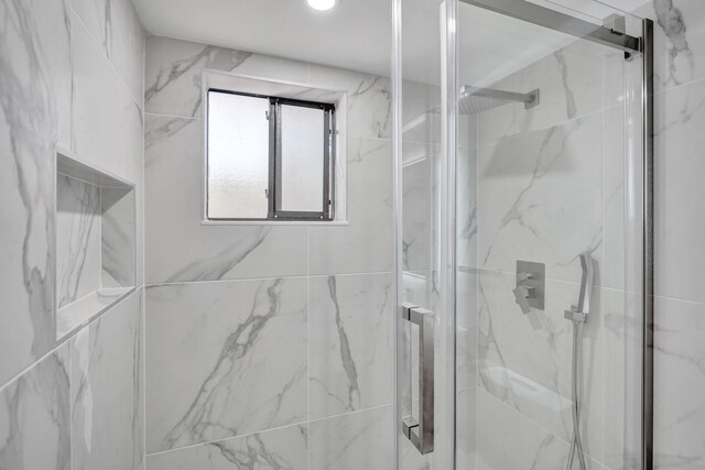 bathroom featuring walk in shower