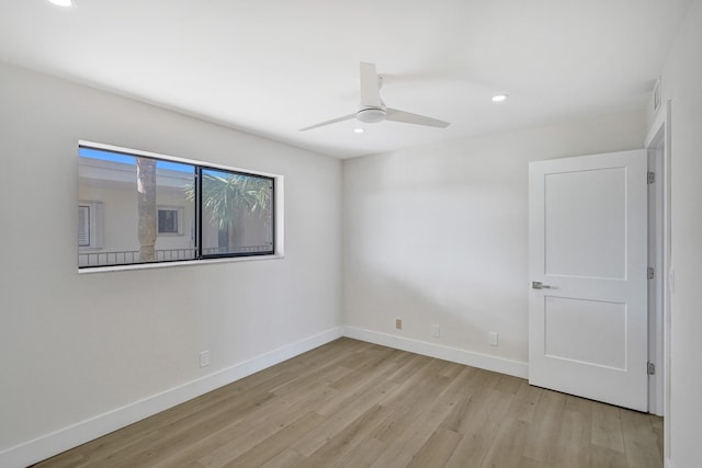 spare room with light wood-style floors, recessed lighting, baseboards, and ceiling fan