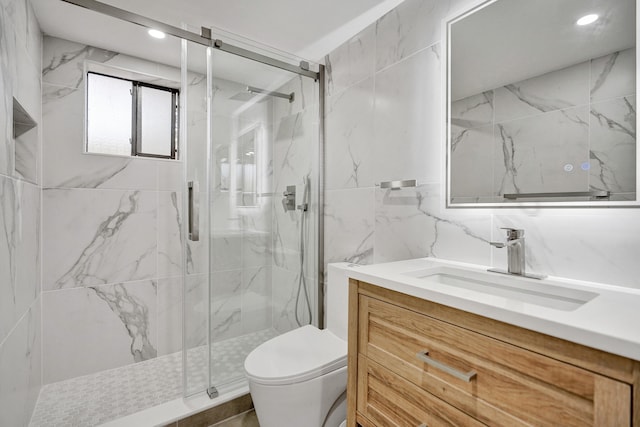 bathroom with vanity, an enclosed shower, tile walls, and toilet