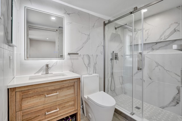 bathroom featuring vanity, toilet, walk in shower, and tile walls