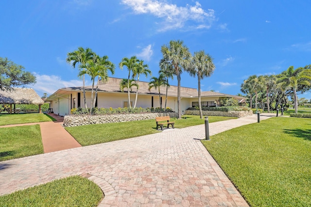 ranch-style home with a front yard