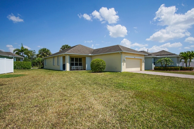 single story home featuring a front yard and a garage