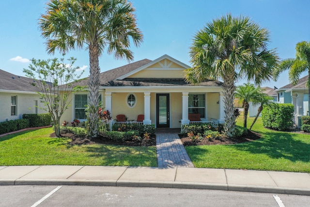 view of front of house with a front lawn and covered porch