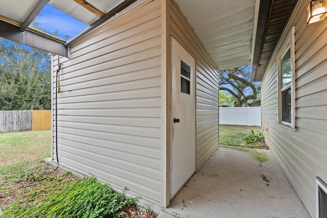 view of side of home with a patio