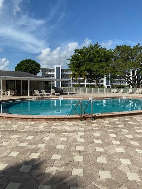 view of swimming pool featuring a patio area