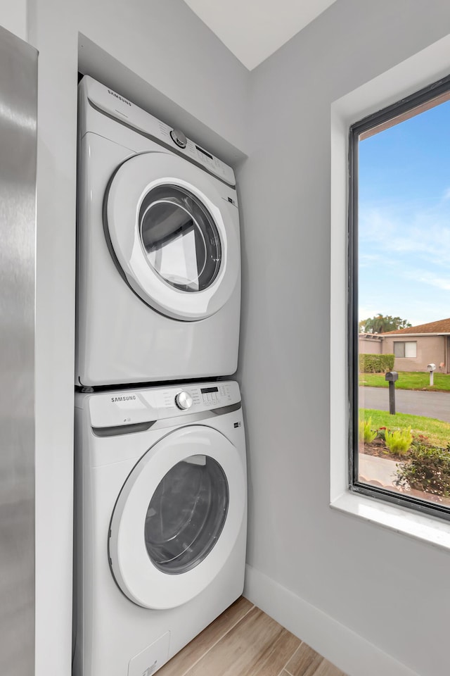 washroom with stacked washer / dryer