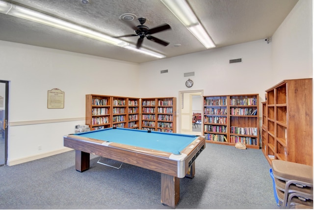 playroom with carpet flooring, a textured ceiling, and billiards