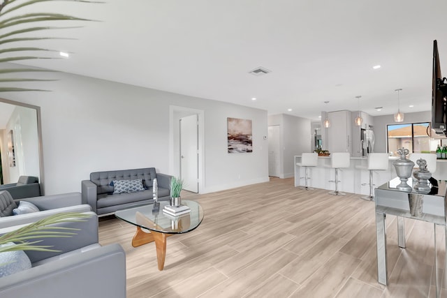 living room with light hardwood / wood-style floors