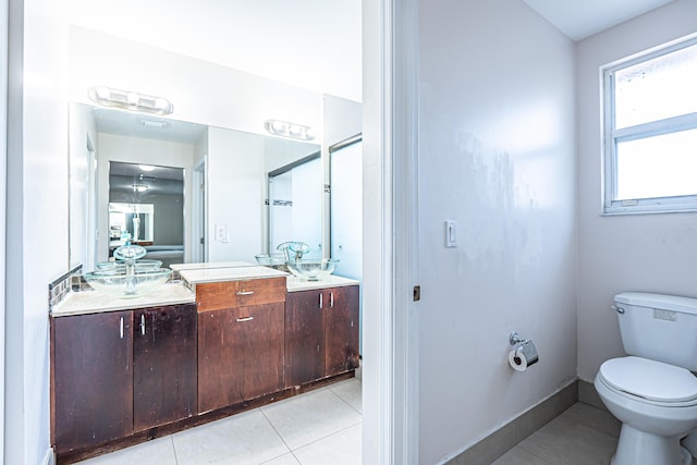 bathroom featuring tile patterned floors and toilet