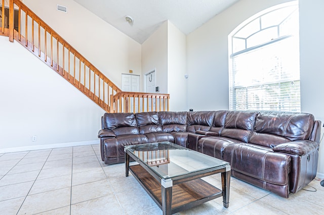 tiled living room featuring lofted ceiling