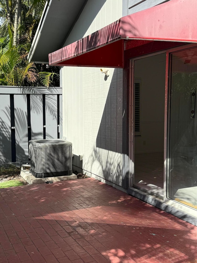 view of side of property featuring central AC unit