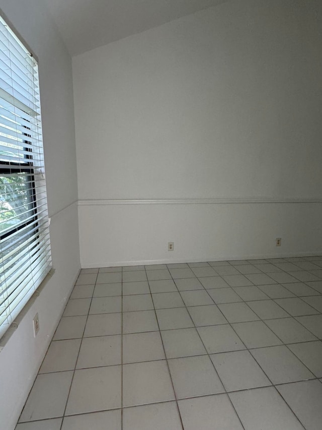 empty room with light tile patterned floors