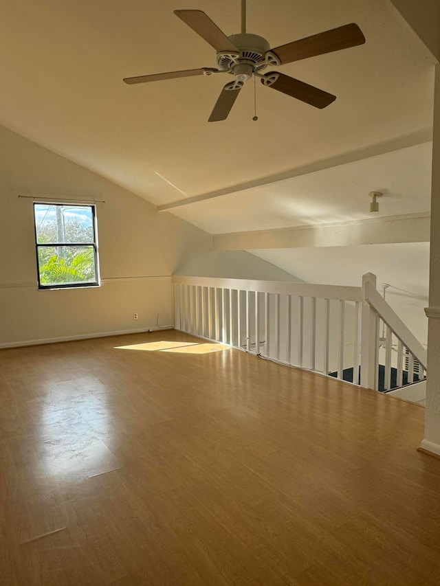 bonus room with ceiling fan, hardwood / wood-style floors, and vaulted ceiling