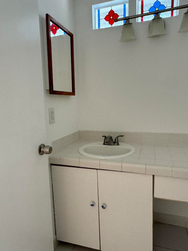 bathroom featuring tile patterned floors and vanity