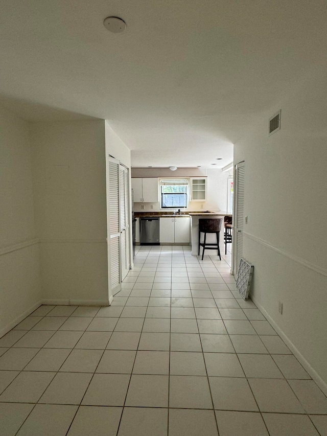 interior space featuring light tile patterned floors