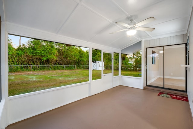 unfurnished sunroom with ceiling fan and lofted ceiling