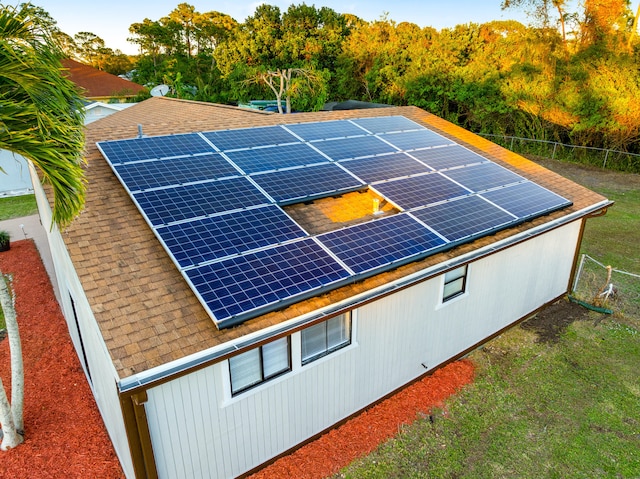 view of property exterior with solar panels