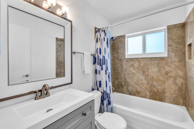 full bathroom featuring vanity, toilet, and shower / tub combo