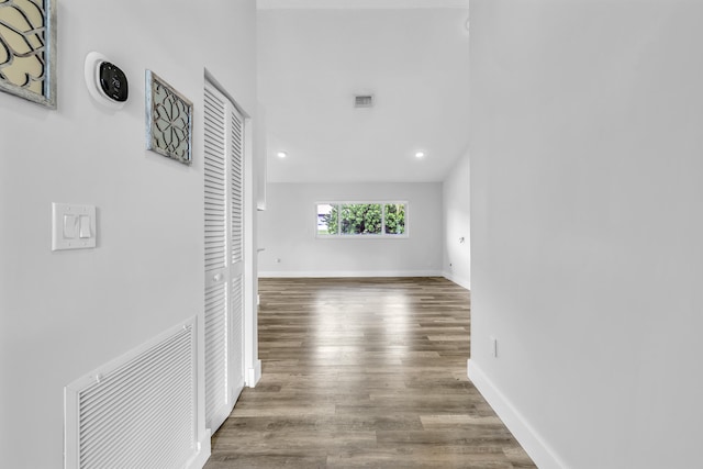 hallway with wood-type flooring