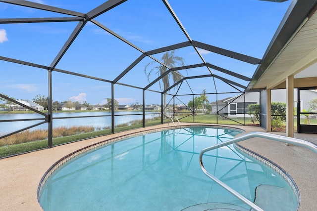 view of swimming pool with a patio, a water view, and a lanai