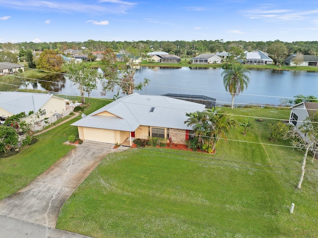 drone / aerial view with a water view