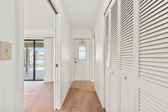 hallway with light carpet