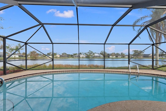 view of pool featuring a water view and a lanai